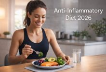 athletic woman eating anti inflammatory foods like salmon vegetables and avocado healthy lifestyle